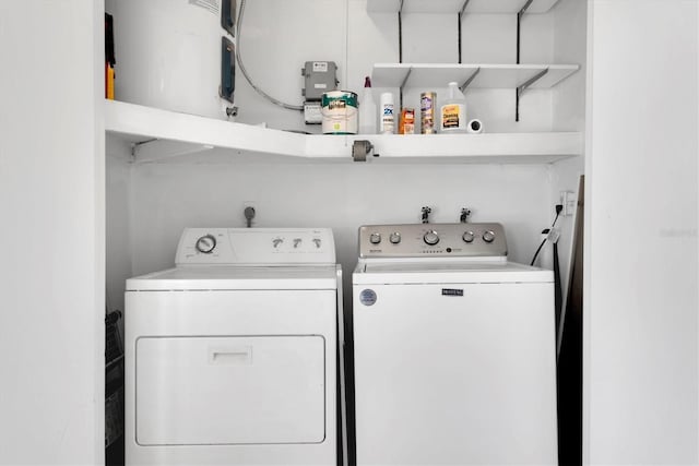 washroom with washing machine and dryer