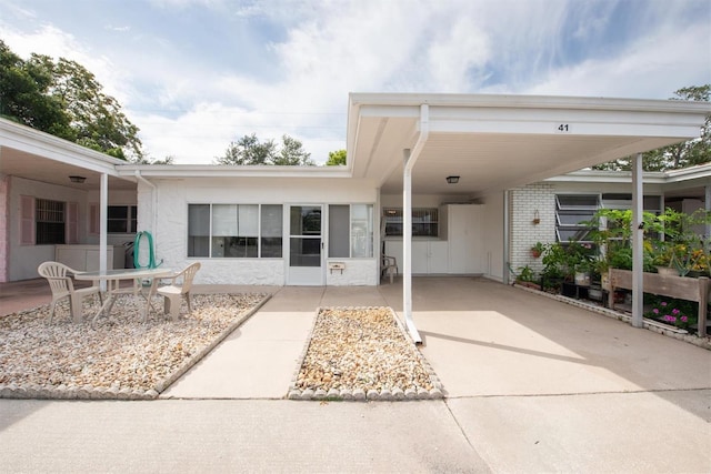 exterior space with a carport