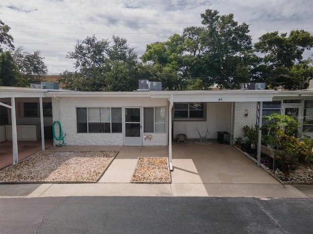 view of front of home with a carport