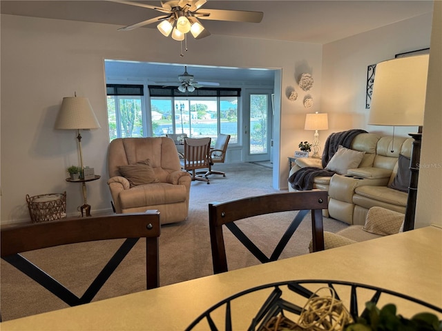 living room featuring carpet and ceiling fan