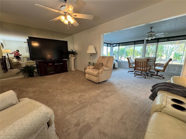 carpeted living room featuring ceiling fan