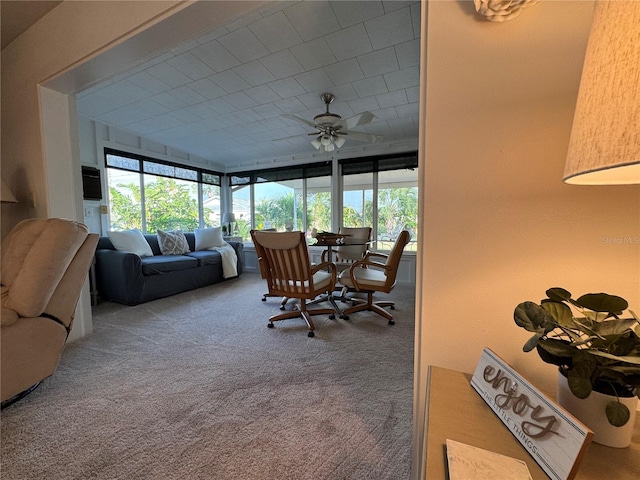 sunroom / solarium featuring ceiling fan