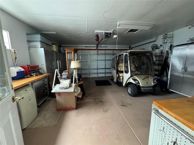 garage featuring a garage door opener