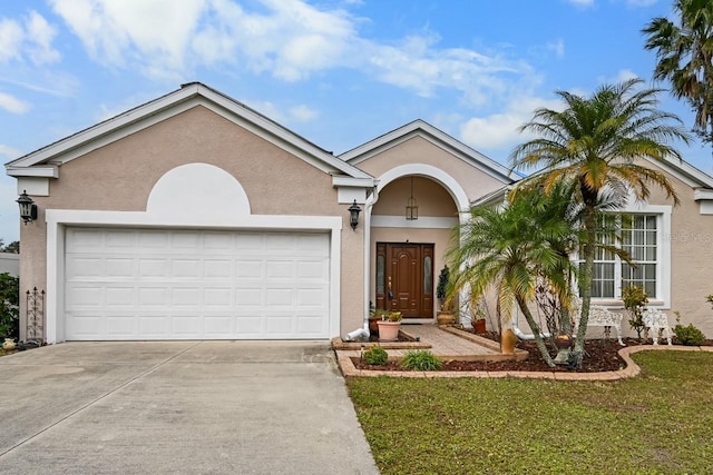 single story home with a front lawn and a garage