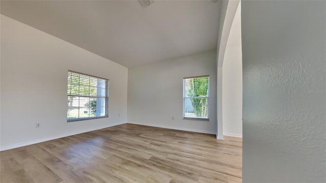 spare room with light hardwood / wood-style flooring