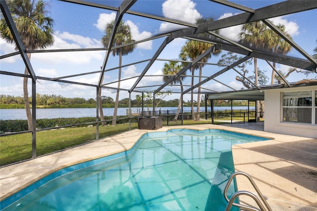 view of pool with a water view, a patio area, and glass enclosure