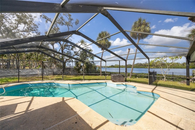 view of swimming pool with a patio area, a water view, and a lanai