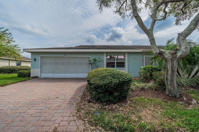 single story home featuring a garage