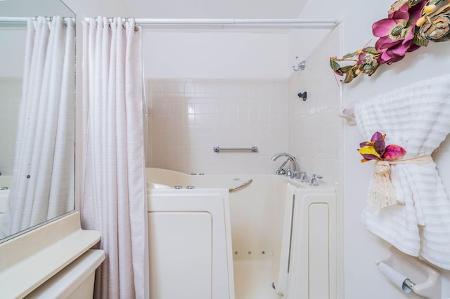 bathroom featuring independent shower and bath