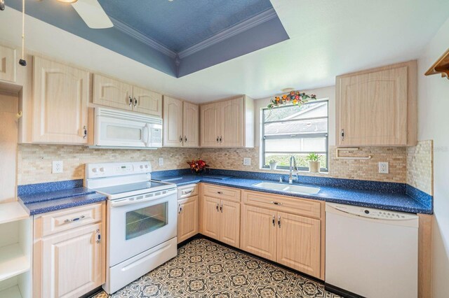 kitchen featuring backsplash, light brown cabinetry, ornamental molding, sink, and white appliances