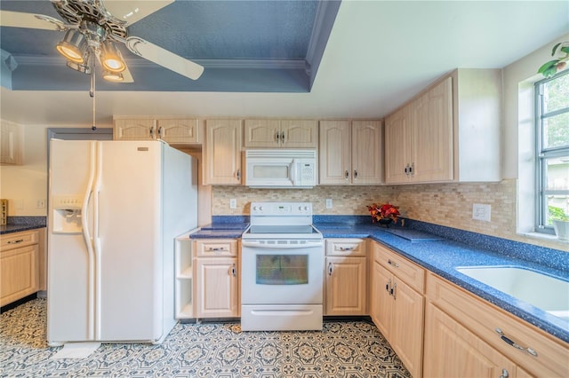 kitchen with white appliances, a wealth of natural light, and light brown cabinets