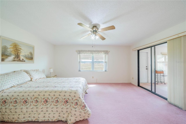 bedroom featuring carpet, a textured ceiling, and ceiling fan