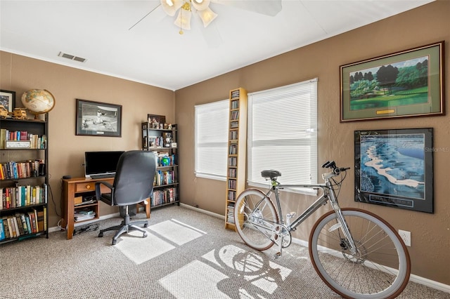 office space featuring ceiling fan and light colored carpet