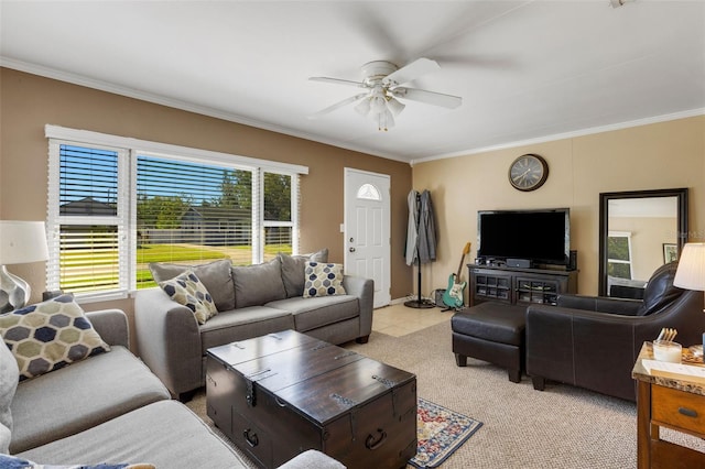 living room with ceiling fan and ornamental molding