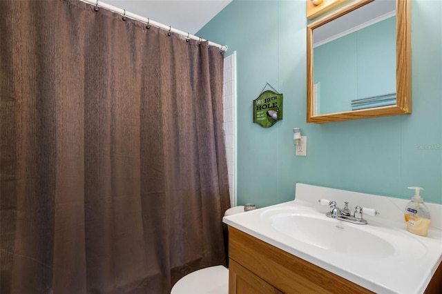 bathroom featuring vanity and toilet