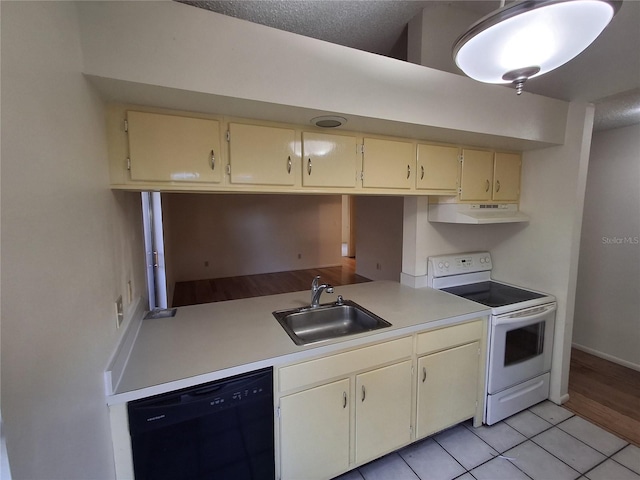 kitchen with black dishwasher, light tile patterned floors, cream cabinetry, white range with electric stovetop, and sink