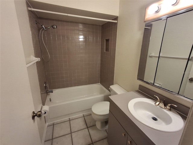 full bathroom featuring vanity, toilet, tiled shower / bath combo, and tile patterned flooring