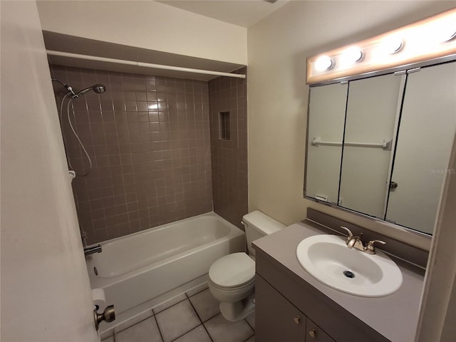 full bathroom with vanity, toilet, tile patterned floors, and tiled shower / bath