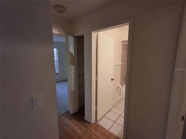 corridor with light wood-type flooring