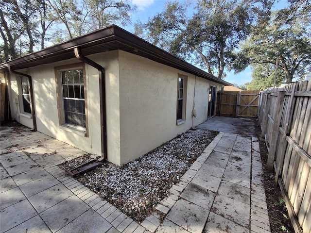 view of side of property featuring a patio