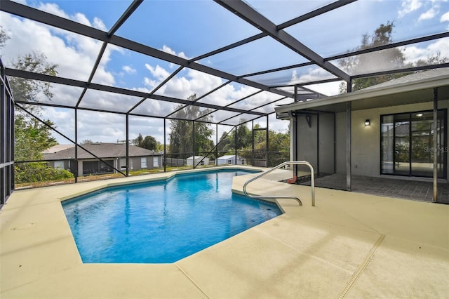 view of pool with a lanai and a patio area