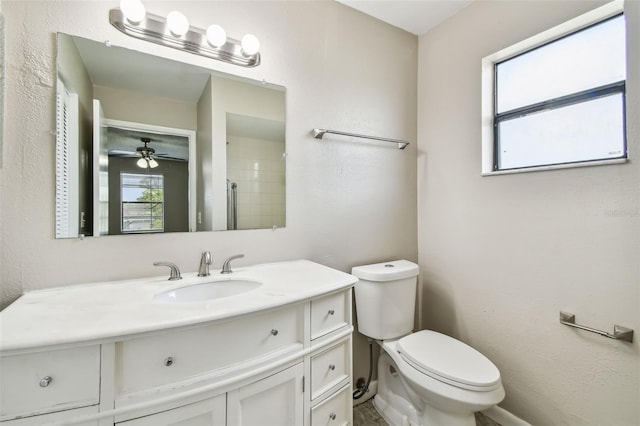 bathroom featuring ceiling fan, vanity, and toilet