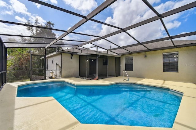 view of pool featuring a lanai and a patio area