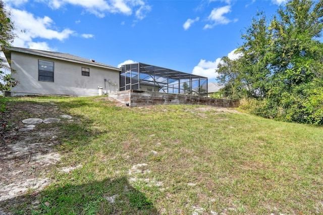 view of yard featuring a lanai