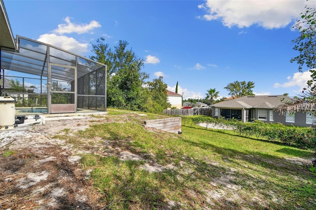 view of yard featuring a swimming pool and a lanai