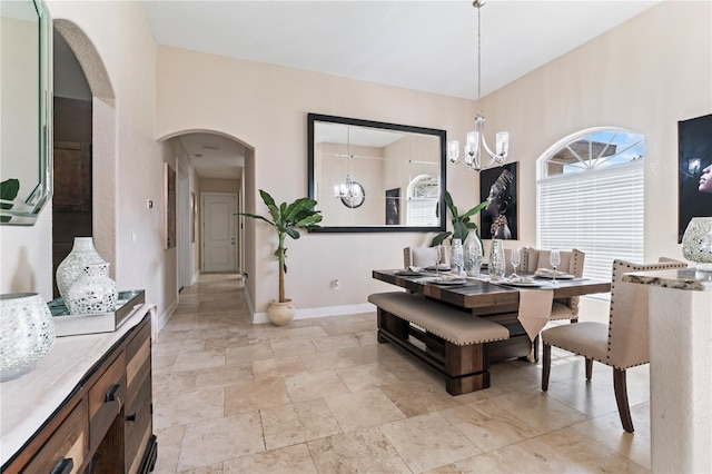 dining room featuring a notable chandelier