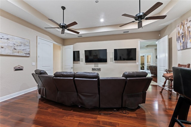 living room featuring dark hardwood / wood-style flooring and ceiling fan