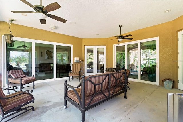 view of patio featuring ceiling fan and french doors