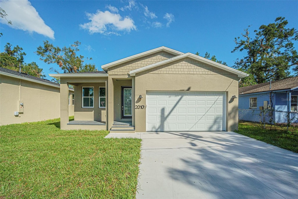 ranch-style house with a front yard and a garage