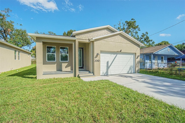 view of front facade featuring a front yard and a garage