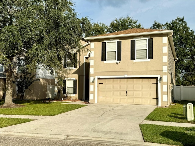 view of front of property featuring a front yard and a garage