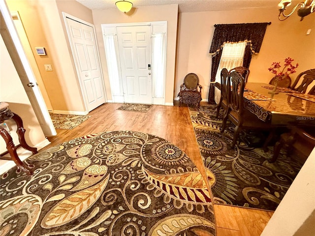 entryway featuring a textured ceiling and hardwood / wood-style flooring