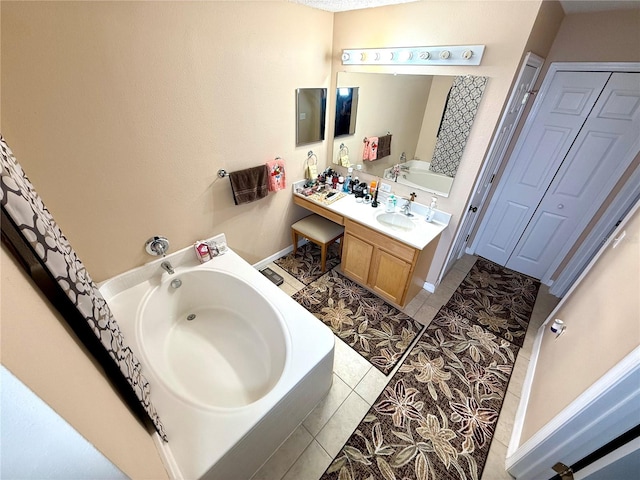 bathroom featuring a bath, tile patterned flooring, and vanity