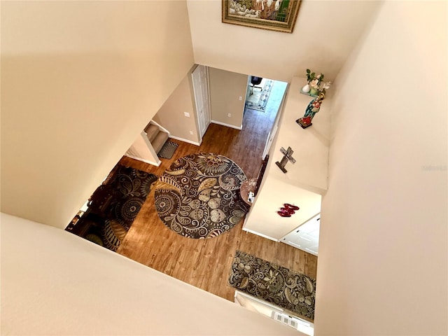 stairway featuring hardwood / wood-style flooring