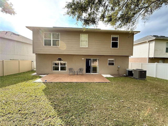 back of property with a patio area, a lawn, and cooling unit