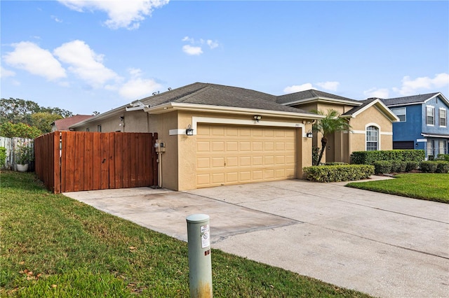 view of front of home featuring a garage and a front yard