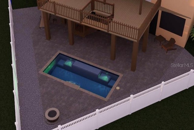 view of swimming pool featuring a jacuzzi and a patio area