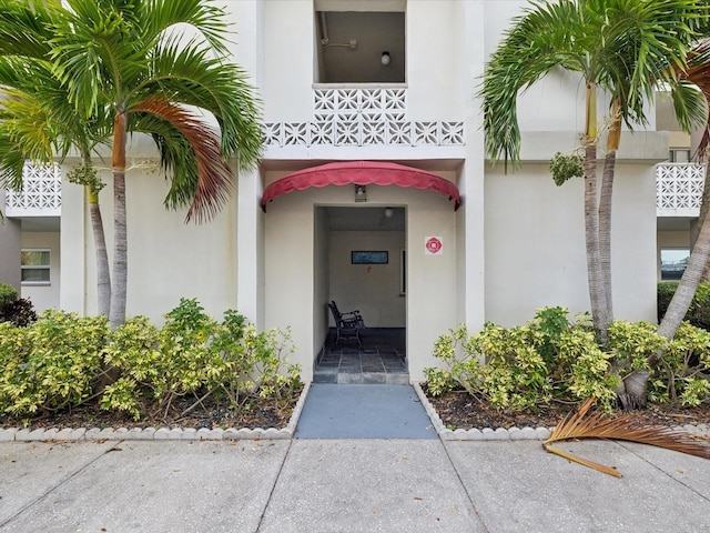 doorway to property featuring a balcony