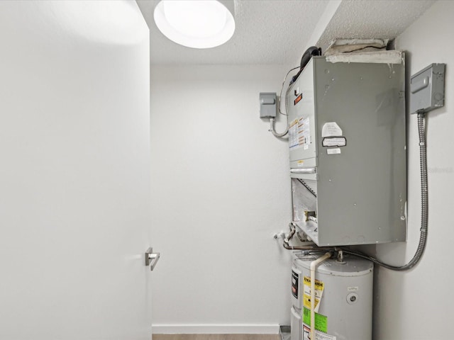 utility room featuring water heater