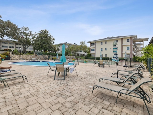 view of pool featuring a patio area