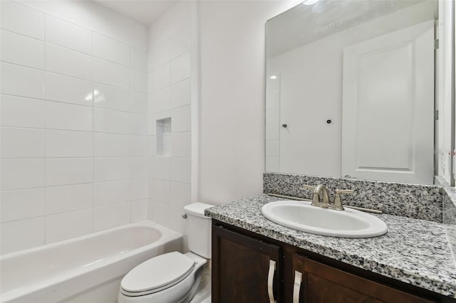 full bathroom with toilet, tiled shower / bath combo, and vanity