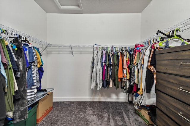 spacious closet featuring dark carpet