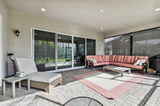 view of patio with outdoor lounge area and a grill