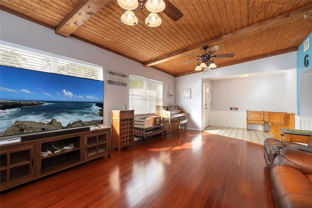 living room with vaulted ceiling with beams, wooden ceiling, light hardwood / wood-style floors, and ceiling fan