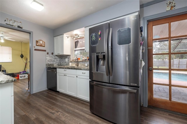 kitchen with white cabinetry, sink, stainless steel appliances, and stone counters