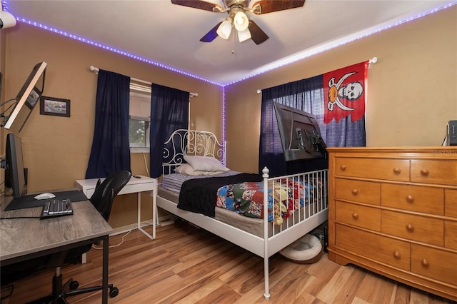 bedroom featuring light wood-type flooring and ceiling fan